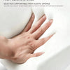 A hand is resting on a white, high-elastic sponge cushion used for a car center console armrest.