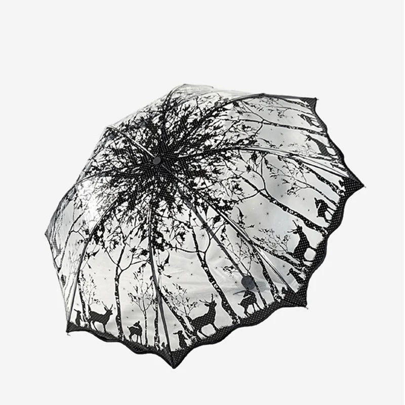 A retro transparent arch umbrella featuring a black and white floral or tree branch design.