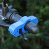 A close-up of a blue motorcycle handlebar brake lock security device attached to the handlebars.