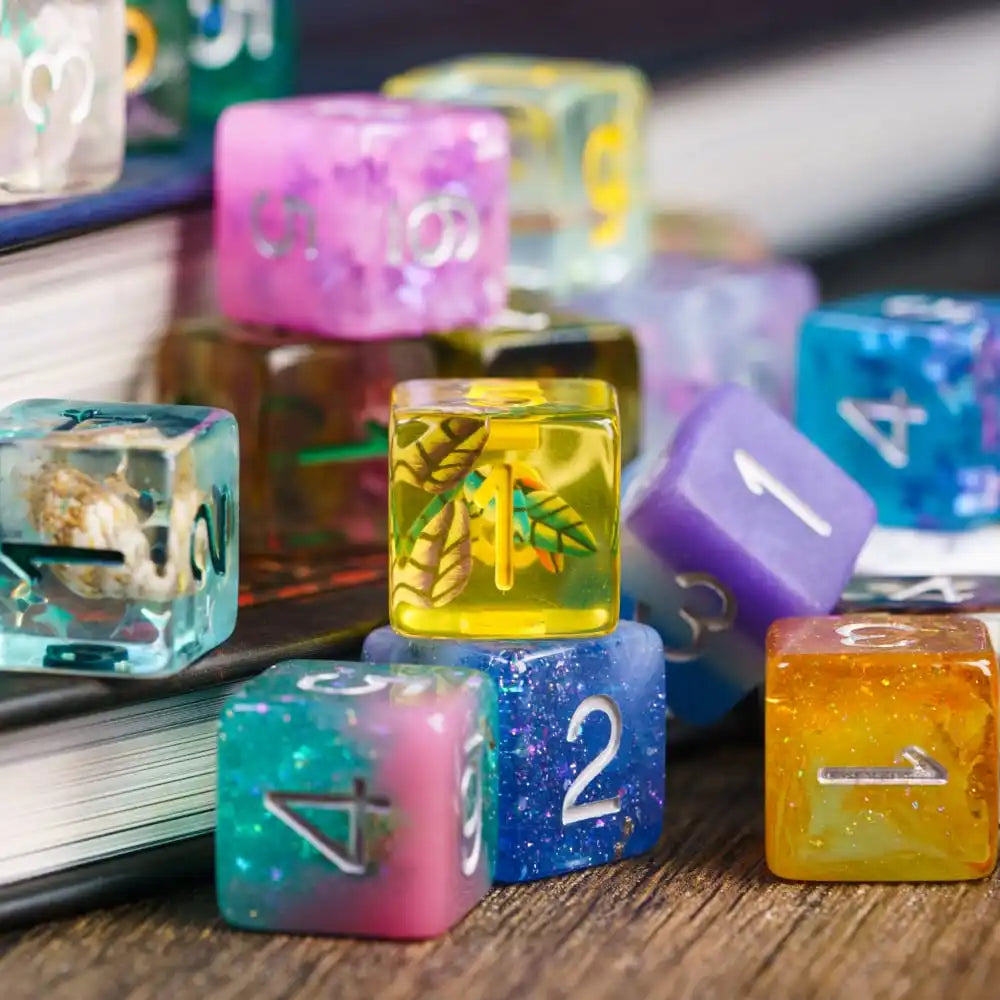 A collection of colorful mystery resin polyhedral dice scattered on a wooden surface.