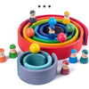 A colorful wooden rainbow stacking block set with various colored wooden stacking blocks arranged in a circular pattern.