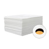 A stack of white disposable bed sheets with a circular cutout showing the rolled fabric.