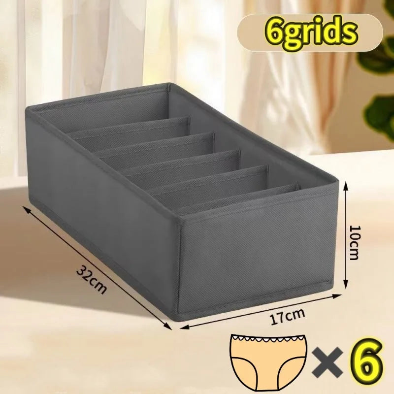 Gray fabric organizer with six compartments shown on a table surface.
