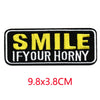 Black and yellow embroidered iron-on letter patch with the text SMILE IF YOUR HORNY