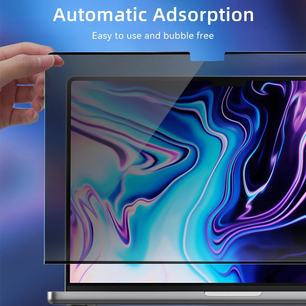 A hand is applying a magnetic privacy screen protector to a laptop display showing colorful liquid art.