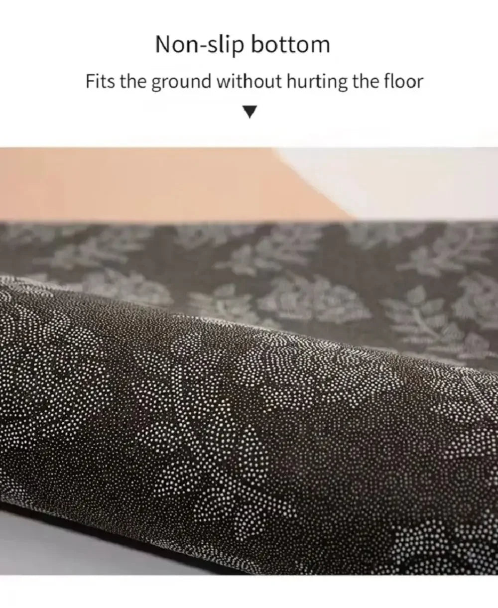 Close-up view of a dark patterned non-slip rug material showing its texture and weave.