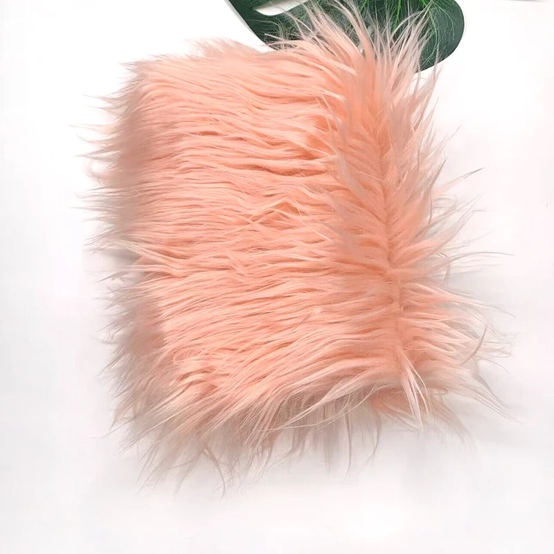 A fluffy pink faux fur fabric used for DIY sewing, doll hair, or cosplay.