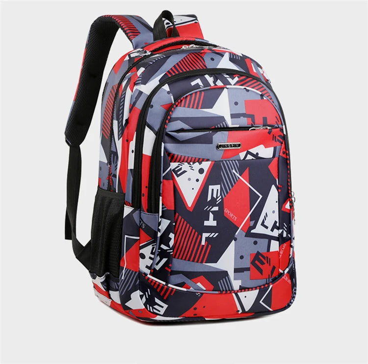 A versatile 16-inch laptop backpack featuring a geometric pattern in navy blue, red, and gray.