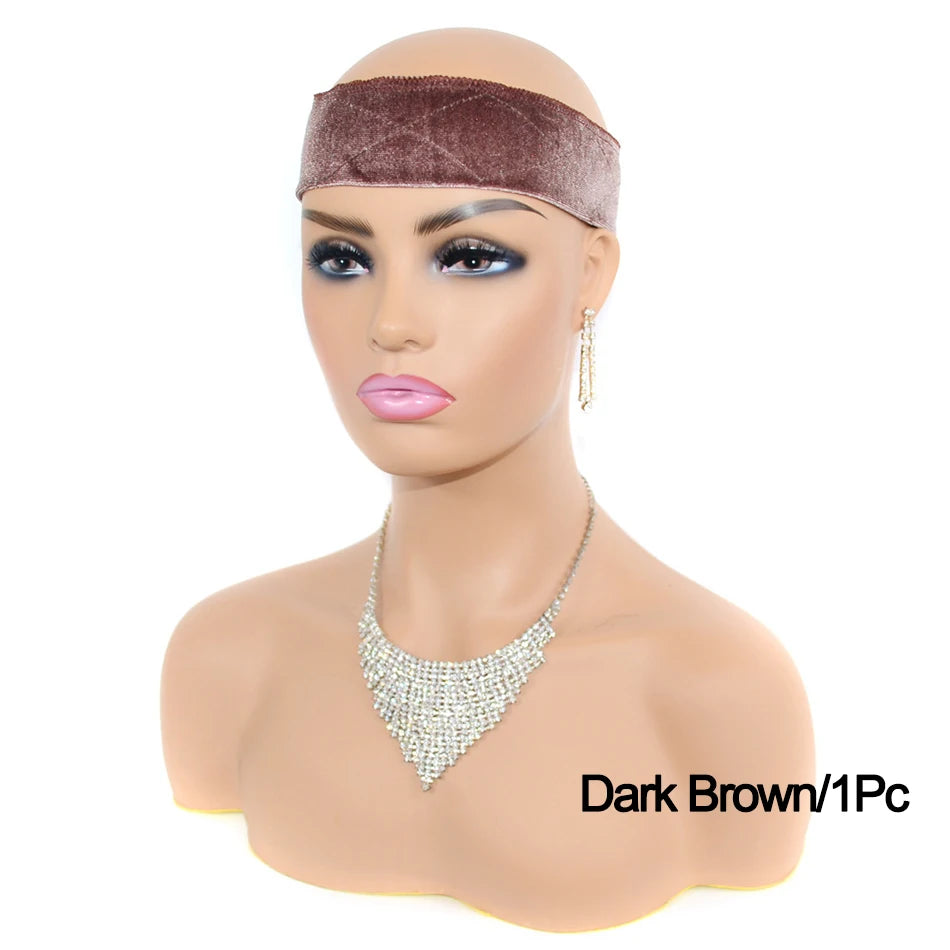 A mannequin head displaying a dark brown velvet headband and gold earrings.