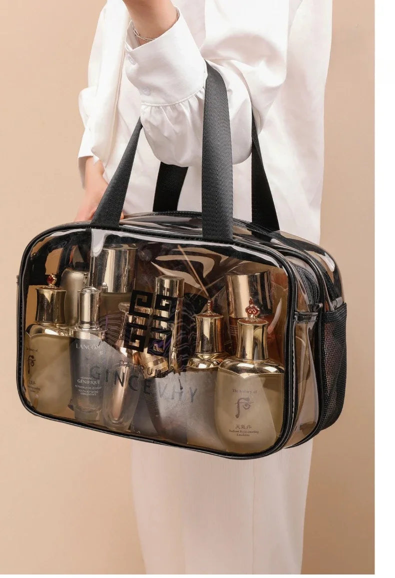 A transparent PVC travel toiletry bag filled with various glass bottles and toiletries.