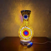 A handcrafted Turkish mosaic table lamp with a warm LED glow, featuring intricate glass pieces on a golden base.