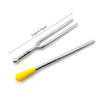 A silver tuning fork set with a yellow activator, shown against a white background.