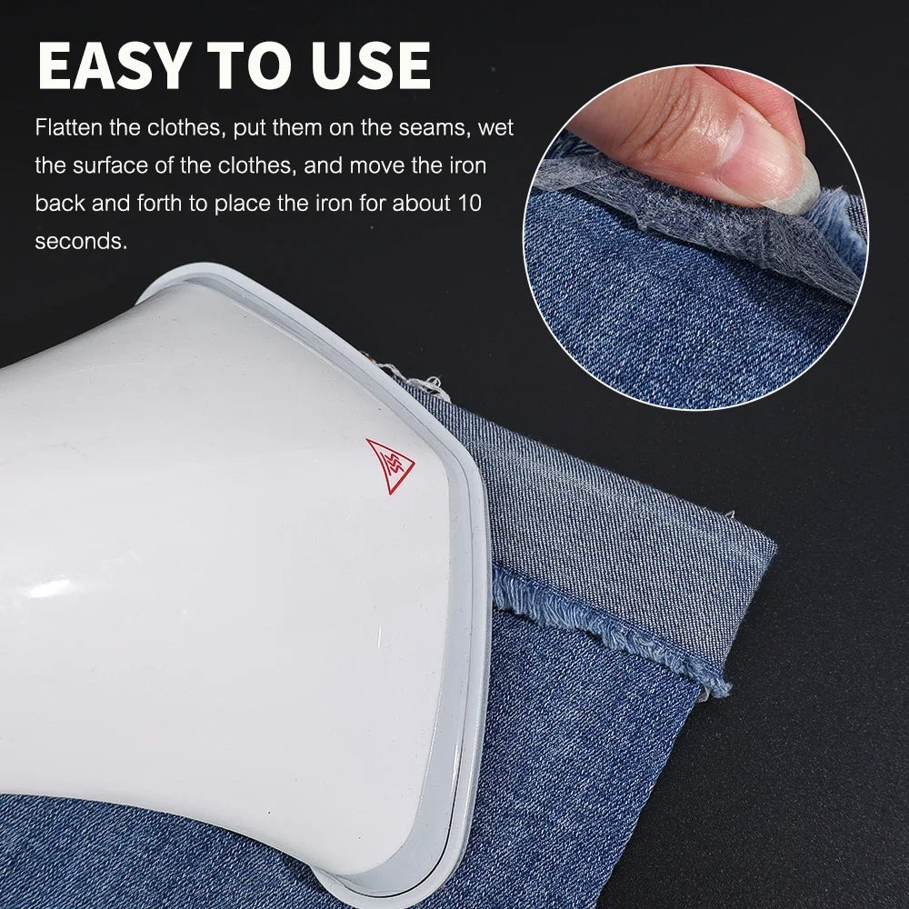 Close-up of a white iron-on fabric adhesive tape being used to iron denim fabric.