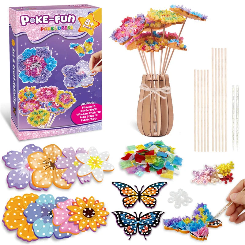 A box of Poke-Fun Flower Dress craft kit showing various fabric flowers and a hand holding a finished flower.