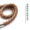 A close-up view of a natural beige rope tieback with a silver metal clasp.