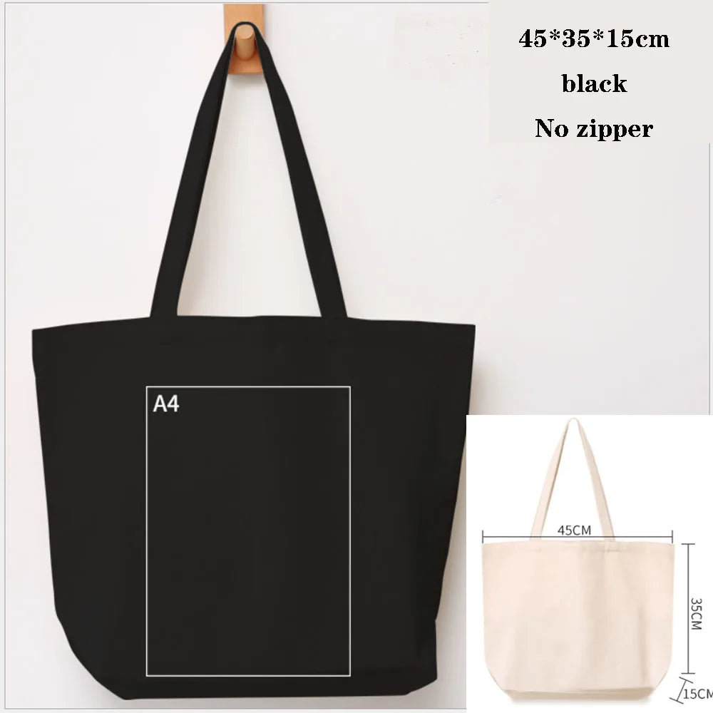 Black canvas tote bag with a handle and an A4 sized square printed on it