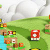 A collection of colorful magnetic building blocks and structures built on a green landscape.