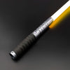 A close-up of a Neo Pixel lightsaber with a smooth swing and 12 color RGB blade, illuminated against a dark background.