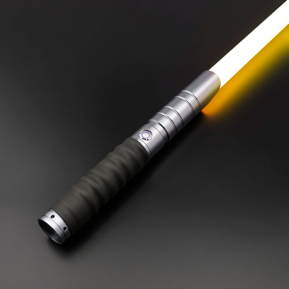 A close-up of a Neo Pixel lightsaber with a smooth swing and 12 color RGB blade, illuminated against a dark background.