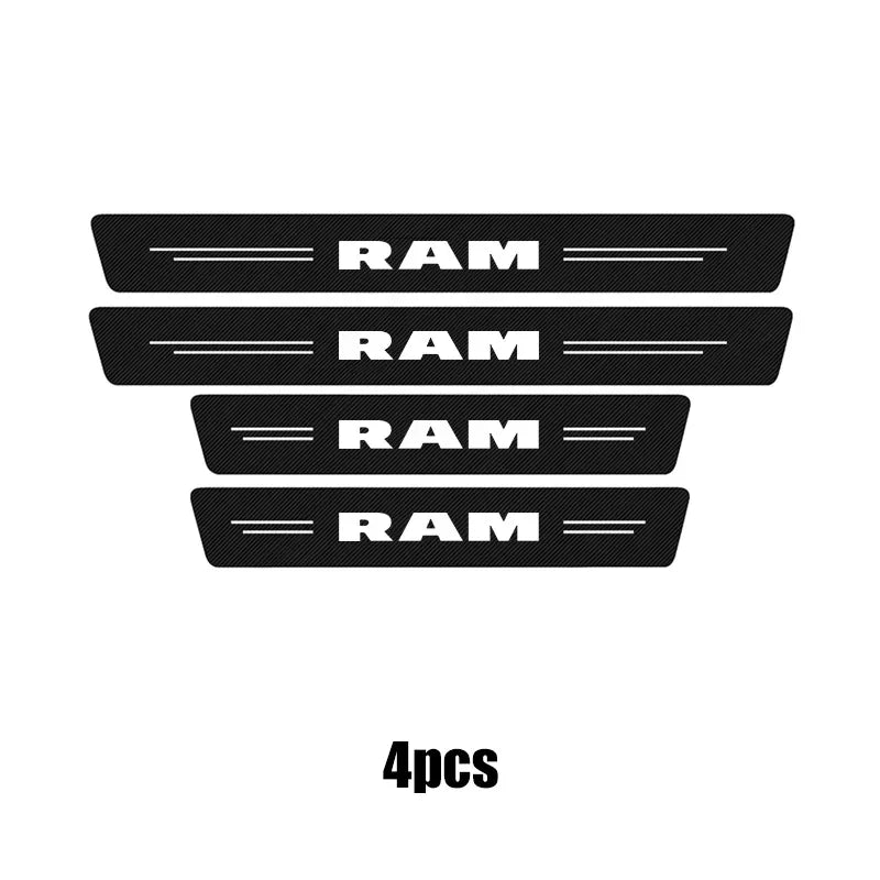 Four black carbon fiber door sill protectors for Dodge RAM trucks.