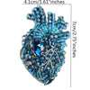 A sparkling blue and silver beaded rhinestone patch shaped like a heart or flame for clothing and crafts.