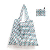 A white and blue patterned reusable shopping tote bag with an attached small carry pouch.