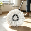 White microfiber mop head with a black triangular insert shown next to a cleaning tool.