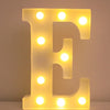 A glowing yellow LED letter E night light with illuminated dots, used for home and party decor.