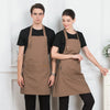 A man and a woman model an adjustable brown cotton apron for kitchen or work use.
