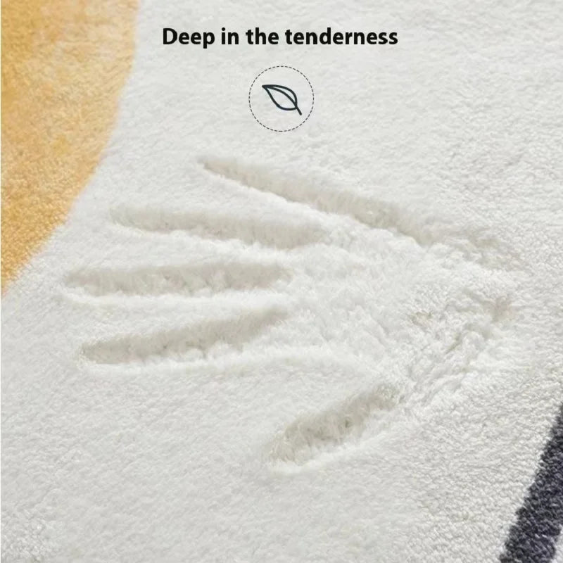 Close-up of a white plush rug showing a handprint design and the text Deep in the tenderness.