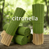 Green citronella incense sticks bundled in natural bamboo, ready for burning.
