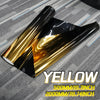 A roll of yellow gradient car window tint film shown against a gray background.