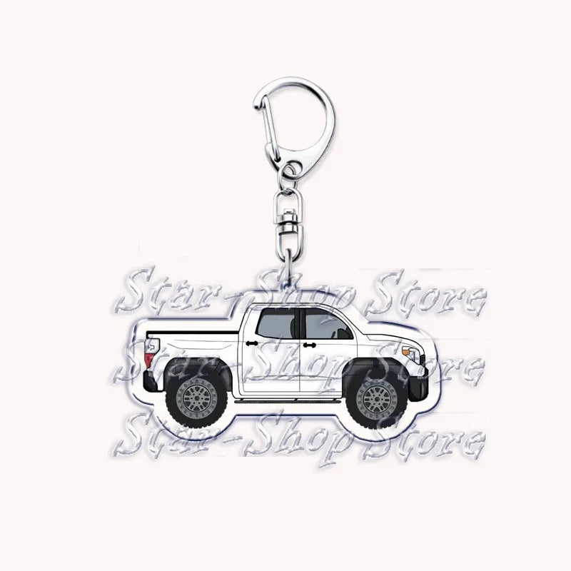 A silver metal key ring with a hook attached, designed as an off-road truck keychain.