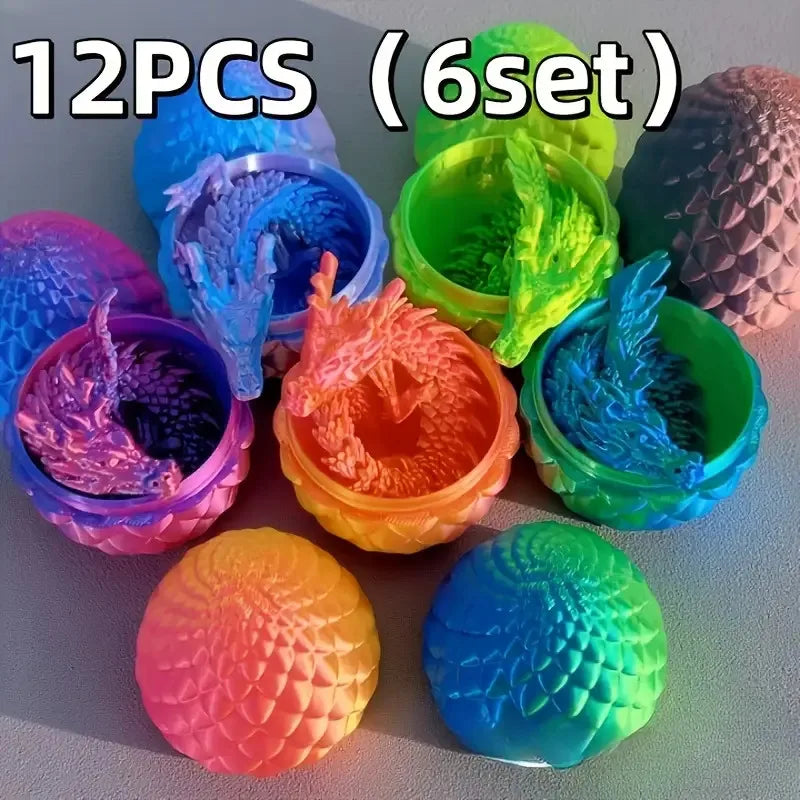 A collection of twelve colorful 3D printed dragon and egg sculptures in various shades of blue, green, and pink.