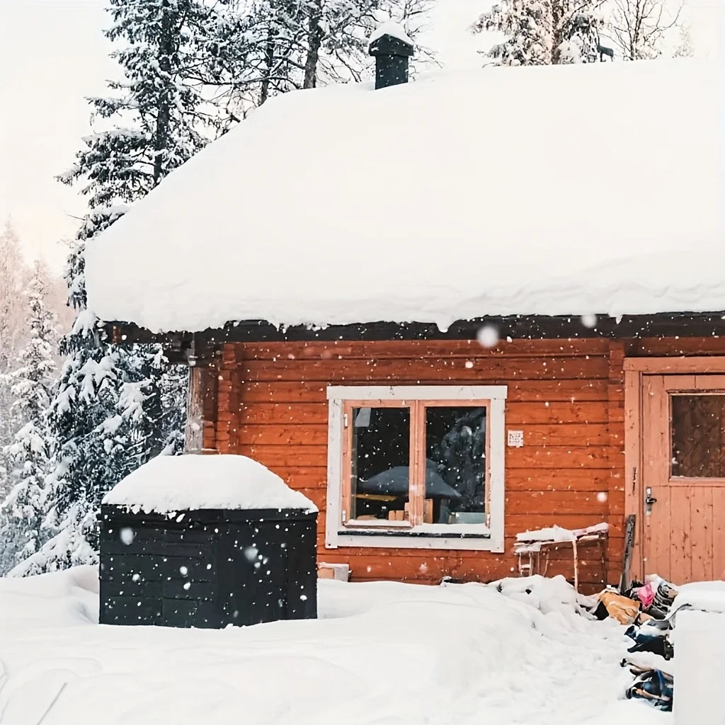 A wooden house with a snow-covered roof and a barbecue grill cover in the foreground.