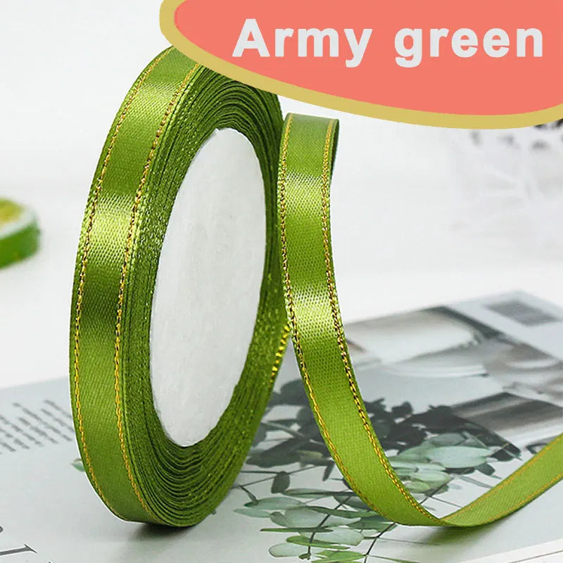 Army green satin ribbon rolled on and unrolled, showing the fabric texture and gold edge.