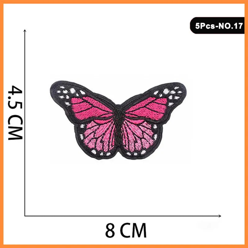 Five embroidered butterfly and rose iron-on patches on a white background.