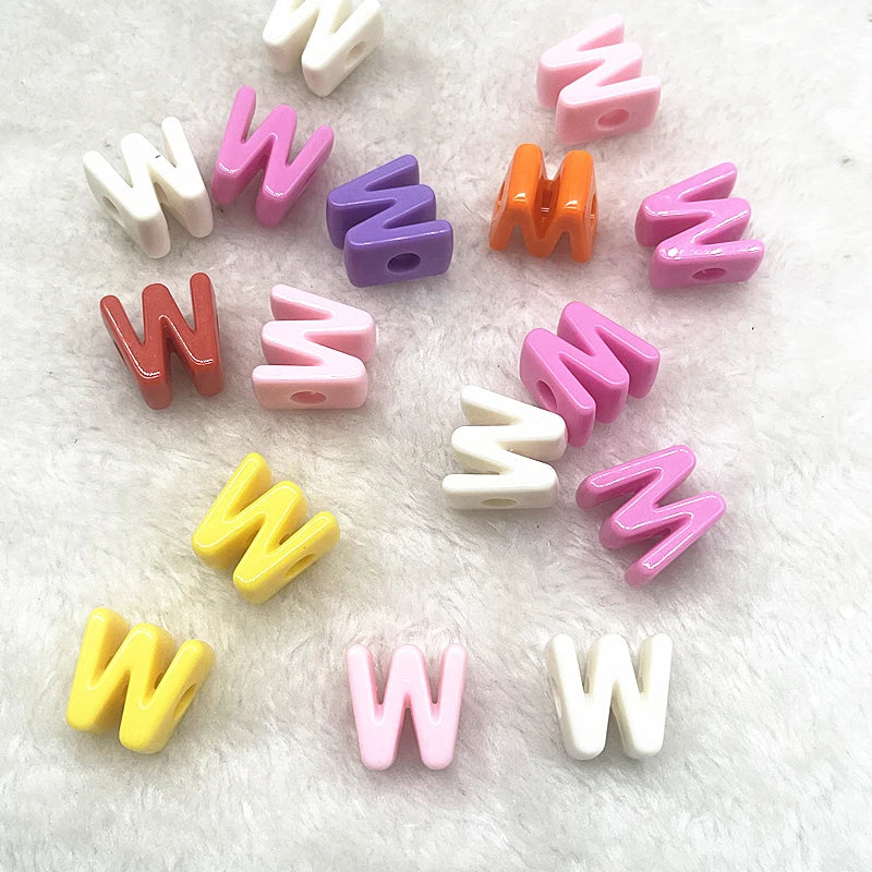 A collection of 10 mixed alphabet letter beads in various pastel colors like pink purple orange and white scattered on a whit