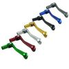 A set of six motorcycle shift levers in various colors including silver, gold, black, red, green, and blue.