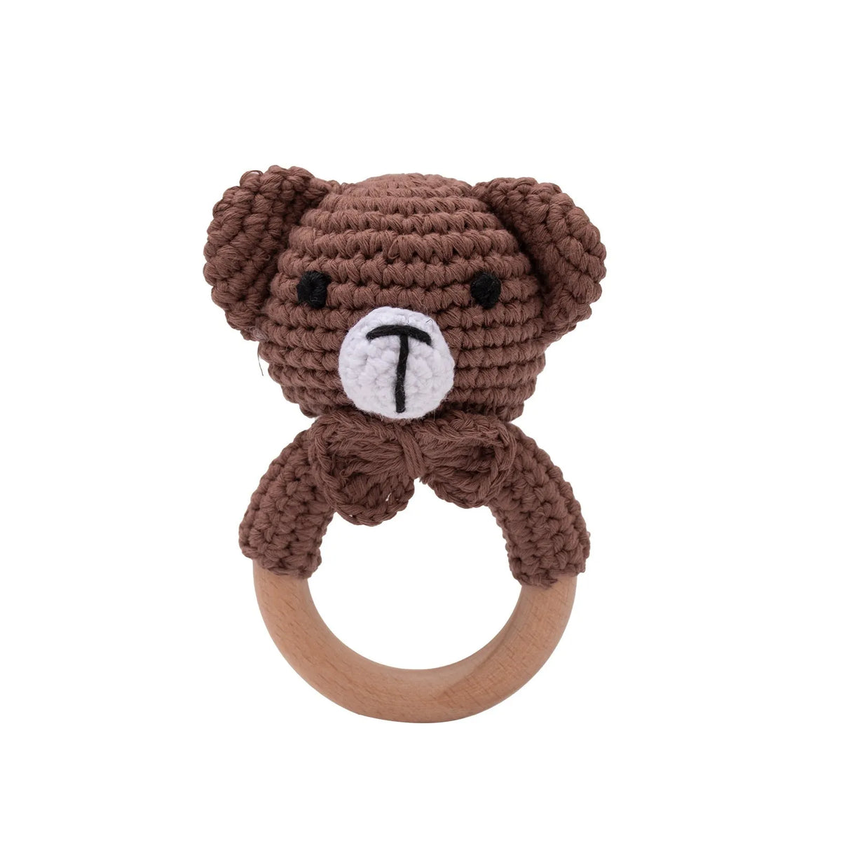A brown crochet teddy bear shaped like a bunny with a white letter T on its chest, attached to a natural wood teether ring.