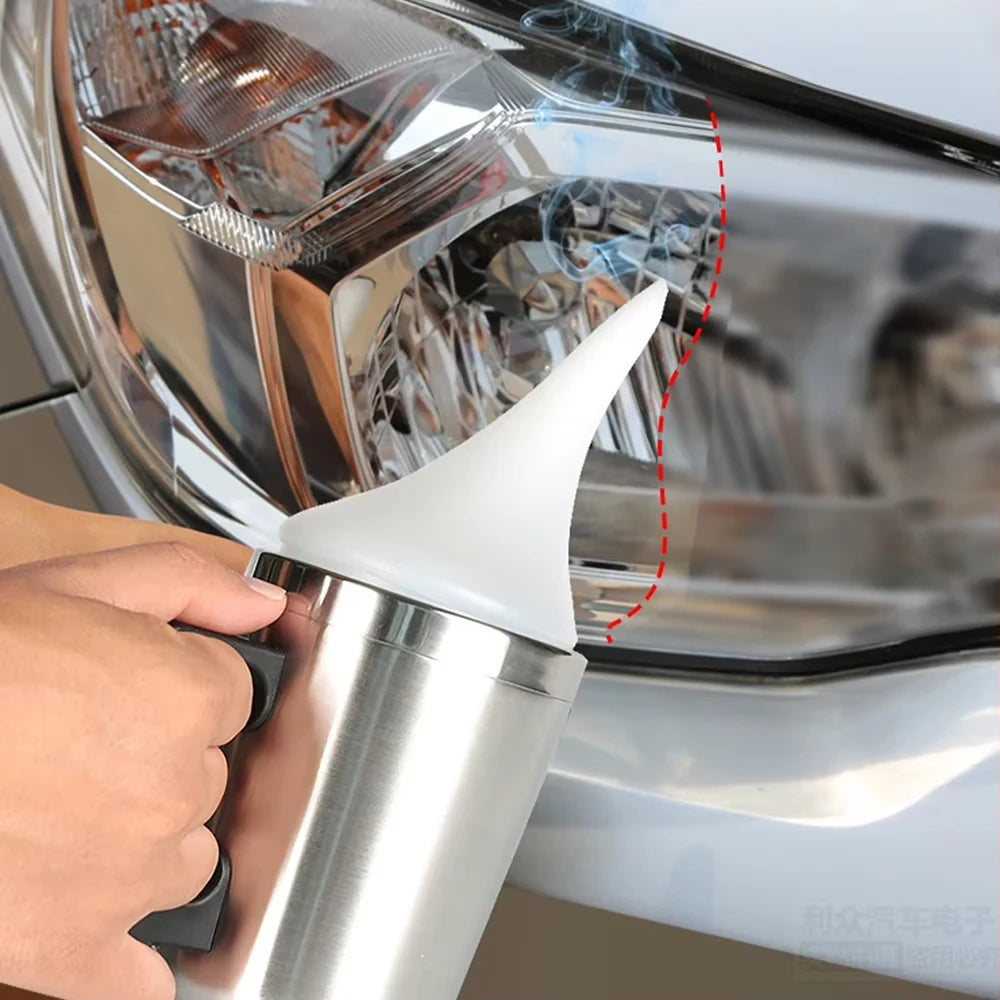 A hand is applying a white substance to the lens of a car headlight using a specialized tool.