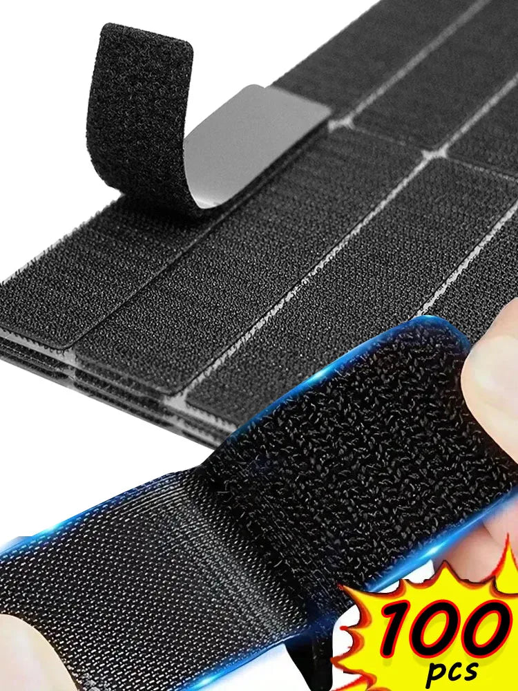 Black hook-and-loop tape for securing car mats or rugs, shown with a hand.