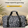A leopard print gym bag with an independent shoe compartment shown against a light background.