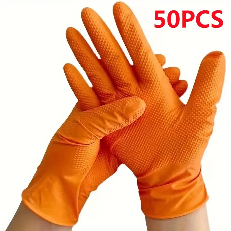 A hand wearing bright orange heavy-duty nitrile disposable gloves with a diamond texture