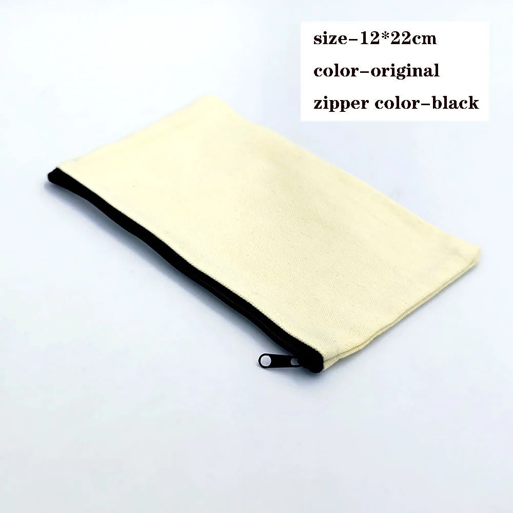A light beige foldable canvas tote bag with a black zipper is shown flat.