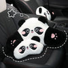A set of black and white panda plush cushions designed as car headrest and lumbar support for a seat.