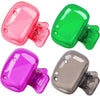 Three silicone toothbrush head covers in pink, green, and purple with clips shown from above.