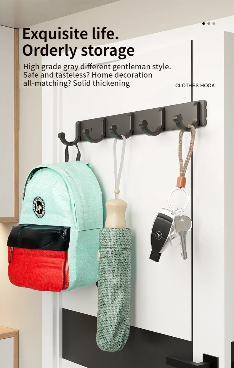 A set of six black wall hooks with adhesive backing are displayed on a white door, featuring various hooks and accessories.