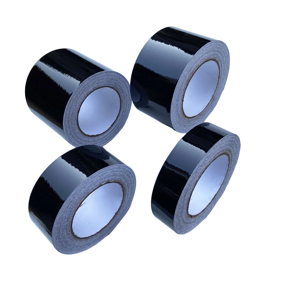 Four rolls of glossy black vinyl wrap strip for car trim and protection