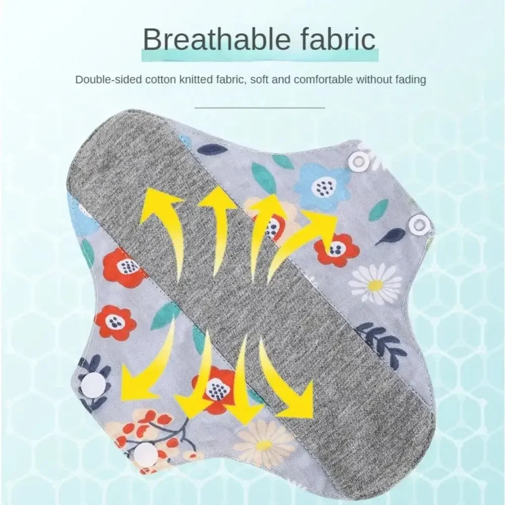 A pair of breathable double-sided cotton knitted menstrual pads featuring floral patterns.